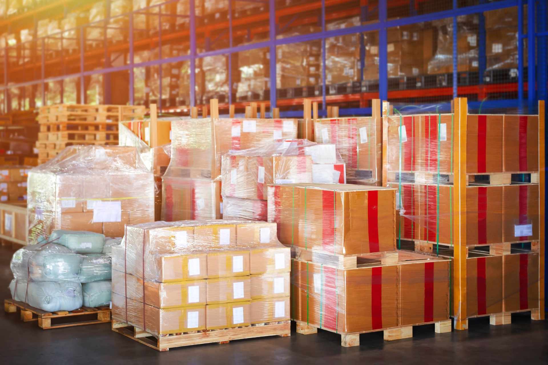 Package Boxes Stacked on Pallets in Storage Warehouse. Storehouse Distribution Storage Tall Shelf. Supply Chain. Shipping Cargo Supplies Warehouse Logistics.